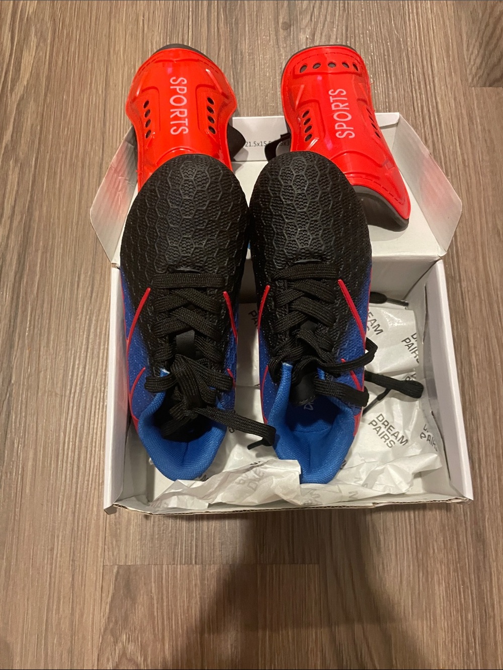 Kids Black and Blue Soccer Sneakers with Red Accents